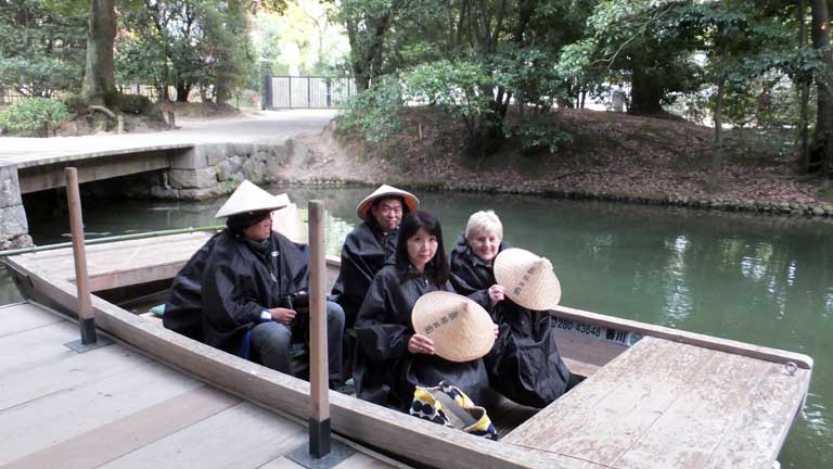 Traditional boat trip round the lake at Ritsurin Gardens